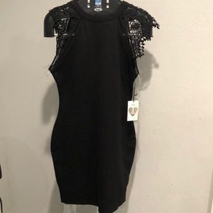 Black dress with lace sleeves.